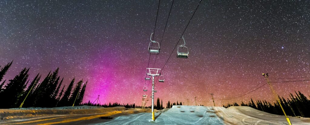 Gondolas at night, it is winter time at night, the skies are clear.