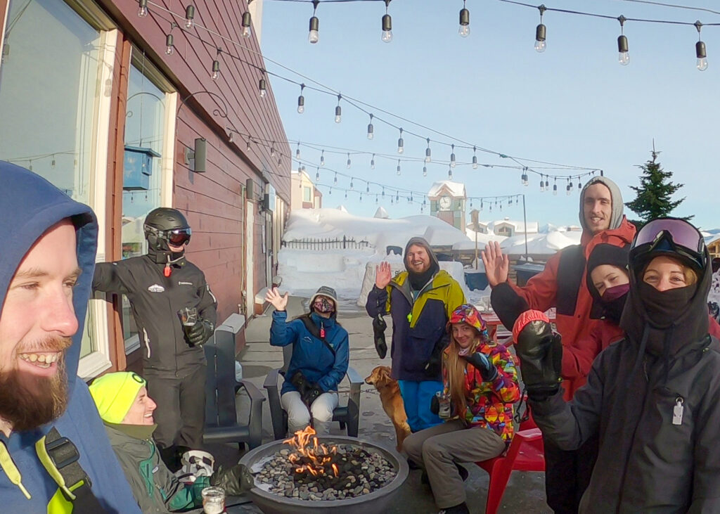 LMVR staff members sit on the patio at a pub at Big White Ski Resort