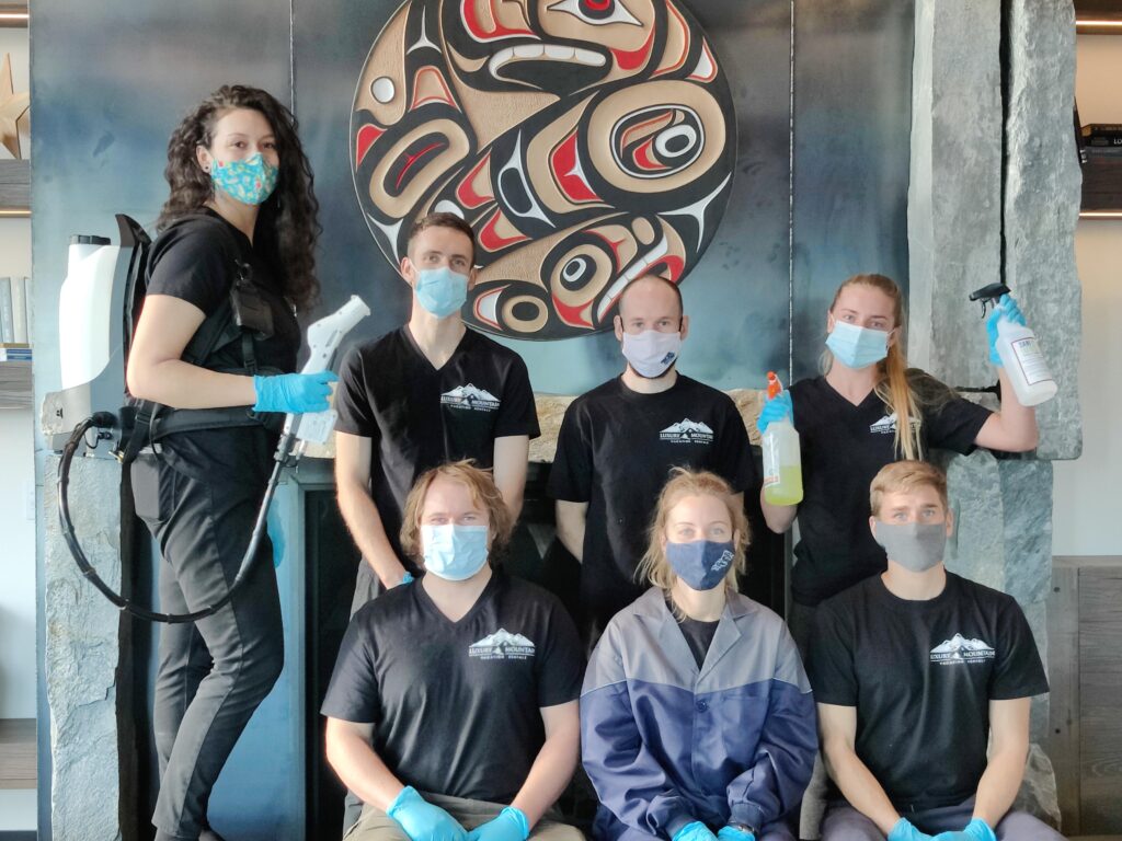 Seven staff members at LMVR at Big White pose for a photo with COVID-19 face-coverings (masks) on