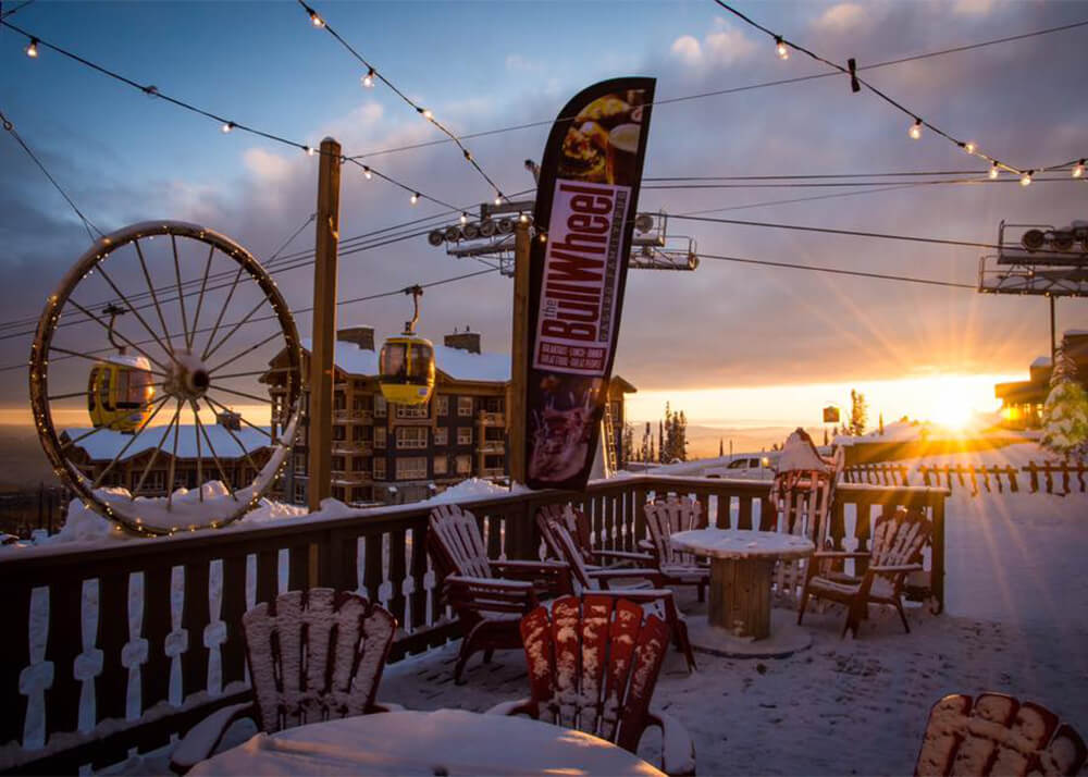 The patio at the BullWheel Gastro Family Pub a restaurant at Big White Ski Resort located in the village.