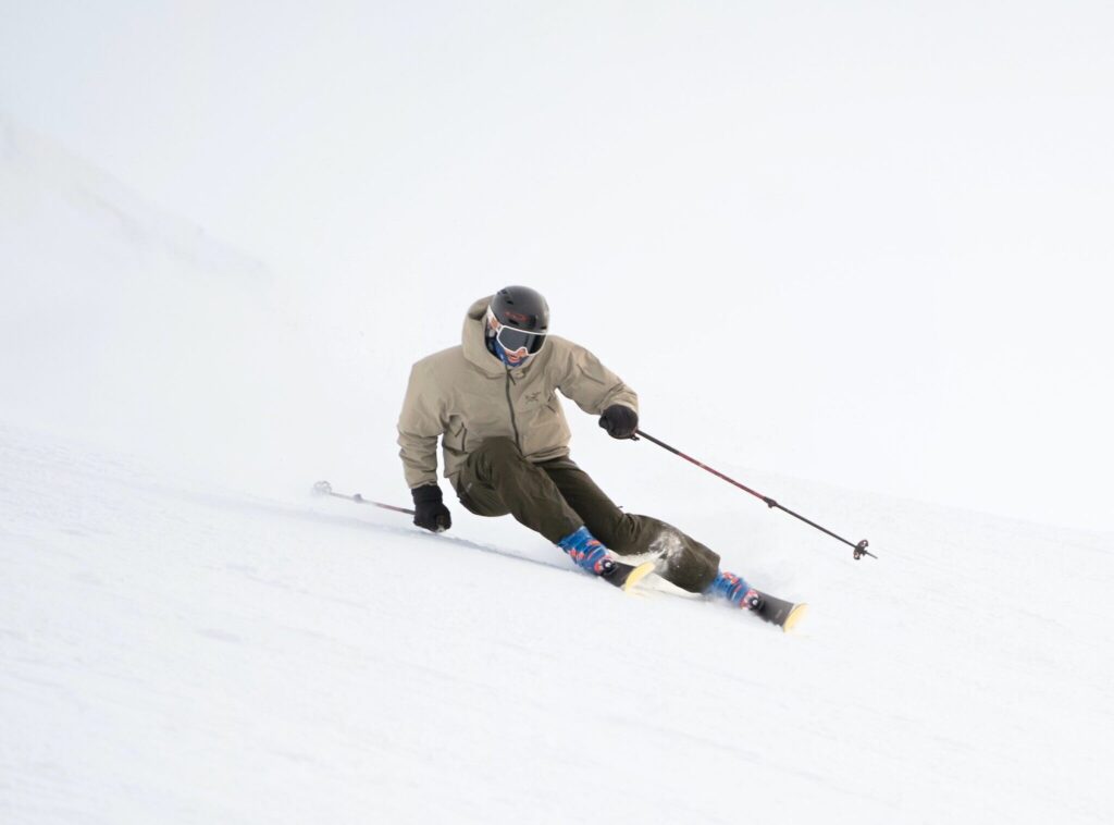 A man downhill skiing at Blackcomb Glacier at Whistler Blackcomb Ski Resort.