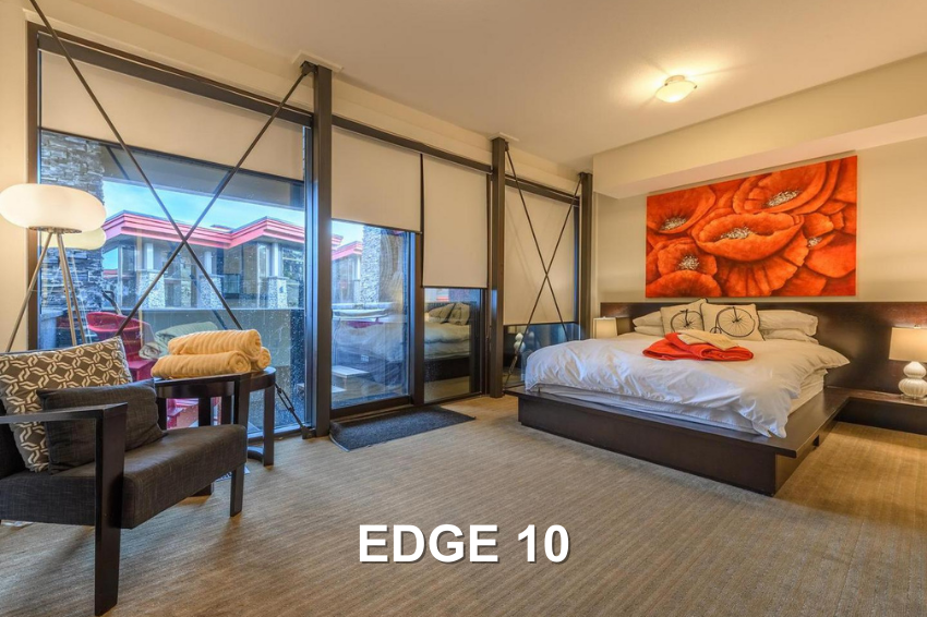 Edge 10 bedroom with luxury modern finishes, comfortable bedding and floor to ceiling windows, managed by Luxury Mountain Vacation Rentals at Big White Ski Resort.