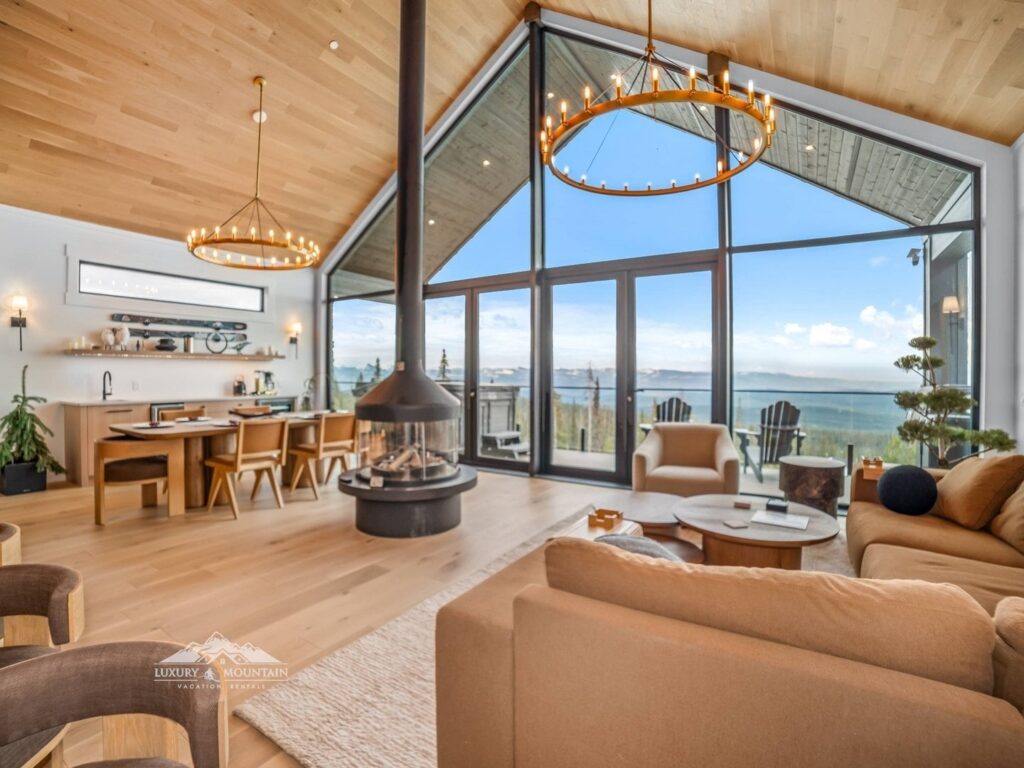 Beautiful living room with high vaulted ceilings and central gas fireplace